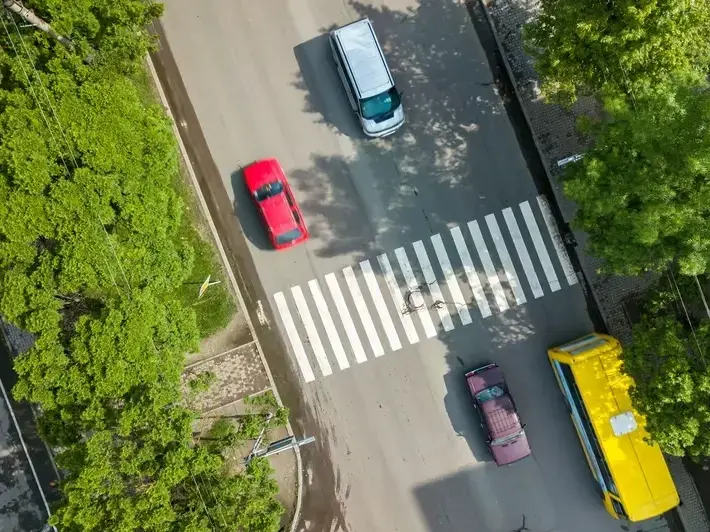 injury lawyer helping driver after side-impact collision on wide suburban road in Eastmark Mesa